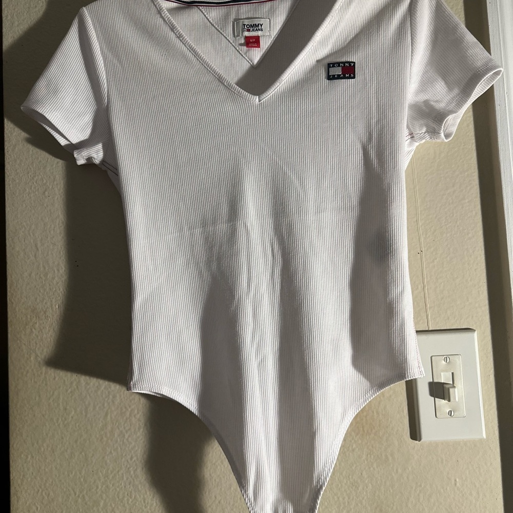 Tommy Hilfiger White Bodysuit . Never worn .